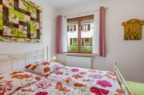 a bedroom with a bed and a window at Untermühle Horchheim in Worms