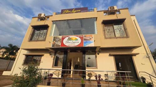 a building with a sign on the front of it at Collection O Sunset Point Pangari Formerly Riveria in Mahabaleshwar