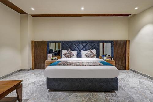 a bedroom with a large bed in a room at Lavanya Hotel- Near Alipur, Delhi in New Delhi
