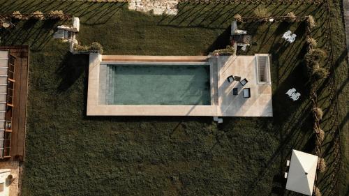 an overhead view of a swimming pool in the grass at Il Giuncheto in Trequanda