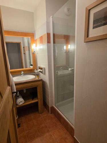 a bathroom with a sink and a shower at Auberge jérôme 614 - Arc 1950 - Duplex prestige 4 rooms 3 bedrooms for 6-8 people 5-star residence Auberge Jérôme - village heart in Arc 1950