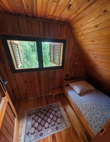 an overhead view of a bedroom in a log cabin at Kremna Cottage in Kremna