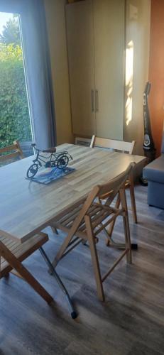 a wooden table with scissors on top of it at Far west location in Vironchaux