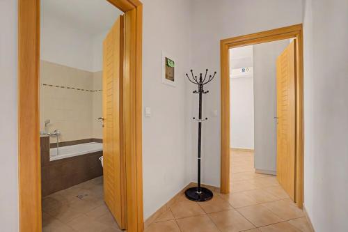 a bathroom with a bath tub and a floor at Alkioni Sea View Apartment in Kato Zakros