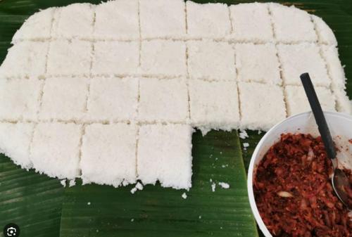 a block of white rice and a bowl of chili at Sinharaja Eco Camp in Deniyaya