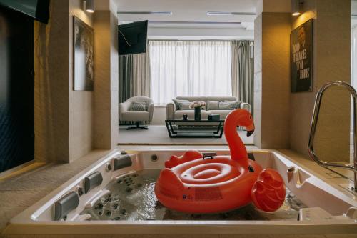 a bathroom with a bath tub with a toy duck in it at Hotel & Medi-Spa Biały Kamień in Świeradów-Zdrój