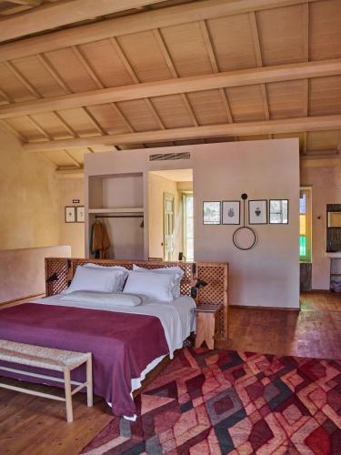 a bedroom with a large bed in a room at Casa Mediterraneo Hotel in Meyisti