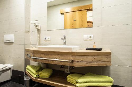 a bathroom with a sink and a mirror at Banders Landhaus in Imst