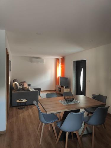 a living room with a table and chairs and a couch at Gondar Stays T2 