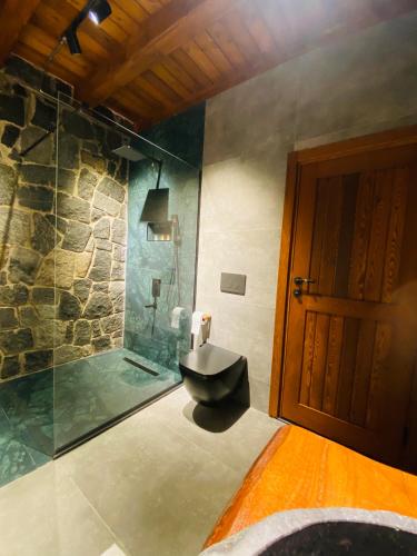 a bathroom with a sink and a shower at Lavinya Suit Bungalov in Rize