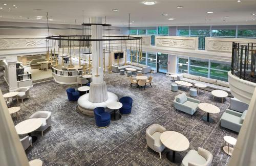 an overhead view of a lobby with tables and chairs at Hilton London Croydon in Croydon