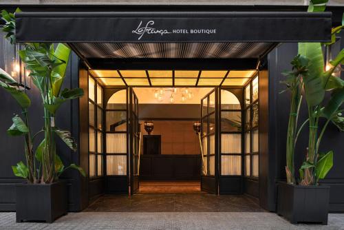an entrance to a store with a black awning at La França Hotel Boutique in Barcelona