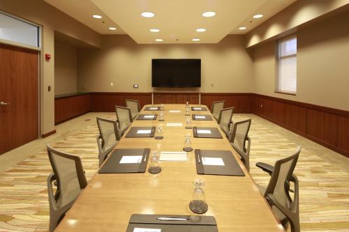 a large conference room with a long table and chairs at I Hotel and Illinois Conference Center - Champaign in Champaign