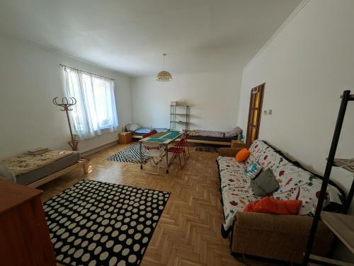 a living room with a couch and a table at B57 guesthouse in Budakalász