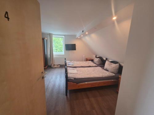 En eller flere senge i et værelse på AmoreMio