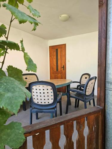 a table and chairs sitting on a balcony at Къщи за гости Кедър in Varna City