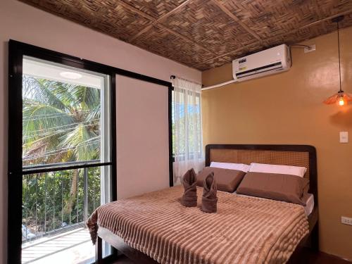 a bedroom with a bed with shoes on it at The LineUp Surf House Pacifico in San Isidro