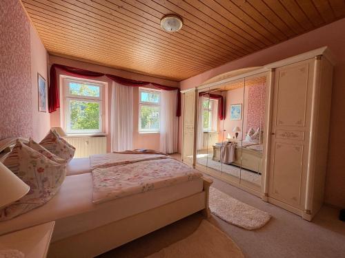 a bedroom with a bed and a large window at Ferienwohnung Heidi in Annaberg-Buchholz