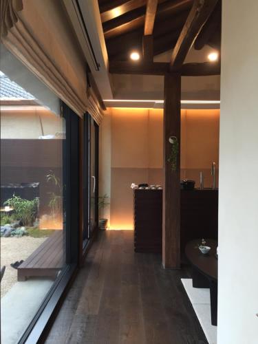 a hallway of a house with a large glass window at 한옥스테이 서유재 in Ch'unch'ŏn-yŏk