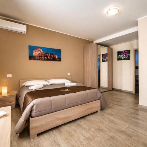 a bedroom with a large bed in a room at Martina paradise Etna in Nicolosi
