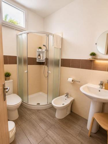 a bathroom with a shower and a toilet and a sink at Martina paradise Etna in Nicolosi