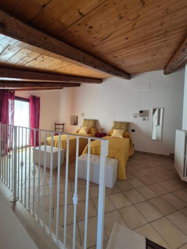 a living room with a bed and a couch at Dimora Suriano in Altamura