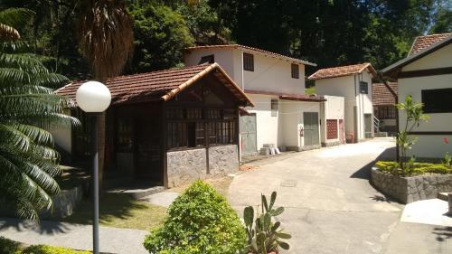 a house with a street light in front of it at Hotel Colonial in Piraí