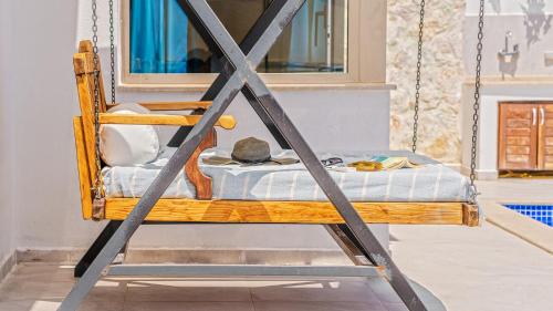a porch swing with a mattress on it at Secluded Sea-View Romantic Escape Villa Bella 4 Leylak in Üzümlü