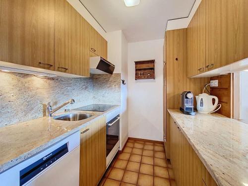 a kitchen with a sink and a counter top at Tayannes 222 in Verbier