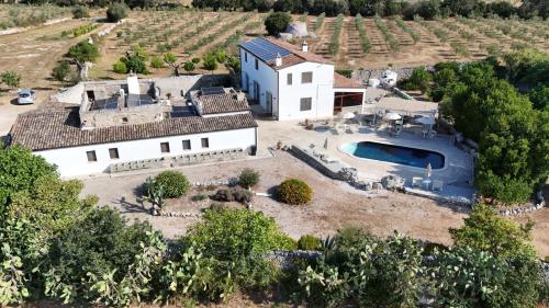 an aerial view of a house with a swimming pool at Agriturismo Masseria Saittole in Carpignano Salentino