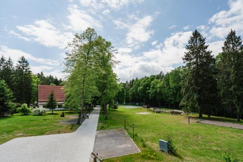a skate park with a skateboard ramp in a park at PÚŠŤ rekreačné stredisko in Prievidza