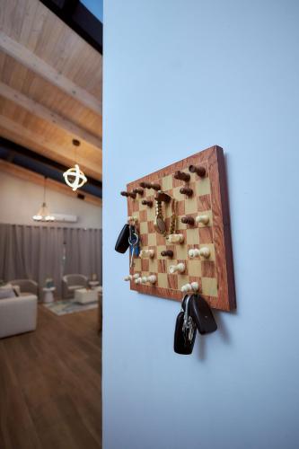 a room with a board with keys on the wall at Pomona Palm Villa in Harare
