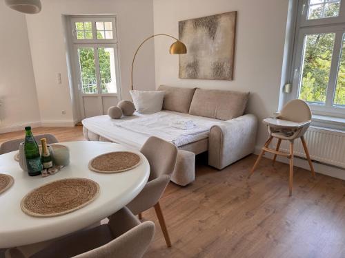 a living room with a couch and a table at Apartment 2 am Werlsee in Grünheide