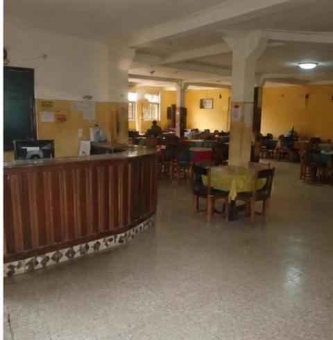 a restaurant with a table and chairs in a room at NH hôtel in Antananarivo