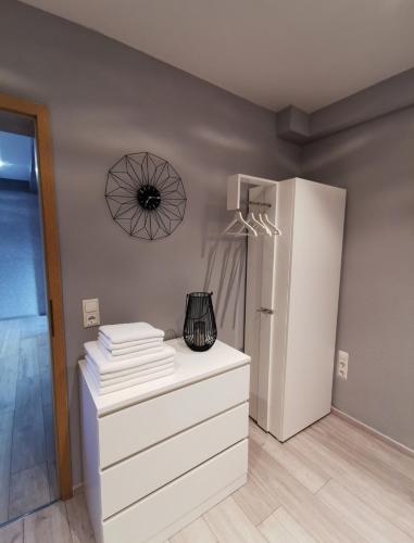 a kitchen with a white refrigerator and a white dresser at Ferienwohnung Liliana in Dannenfels