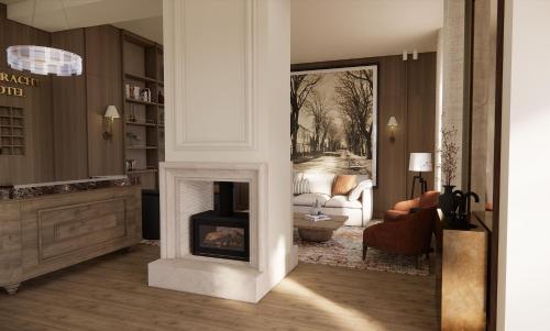 a living room with a fireplace and a couch at Eendracht Hotel in Stellenbosch
