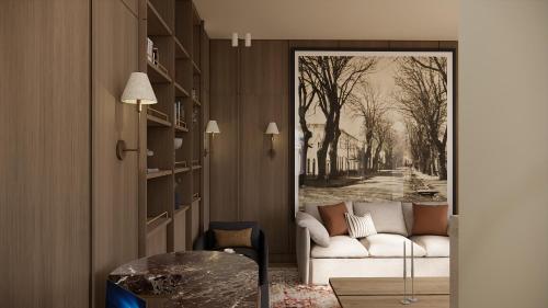 a living room with a couch and a door with a painting at Eendracht Hotel in Stellenbosch