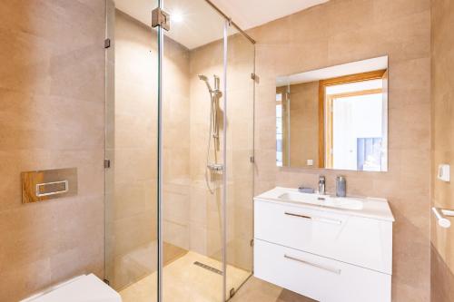 a bathroom with a shower and a sink and a toilet at Appartement Noria Golf in El Makina