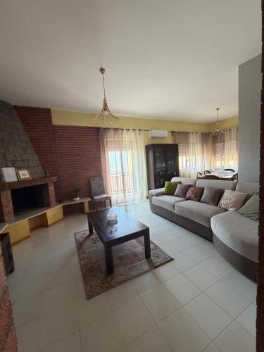 a living room with a couch and a coffee table at KolymBeddra in Agrigento