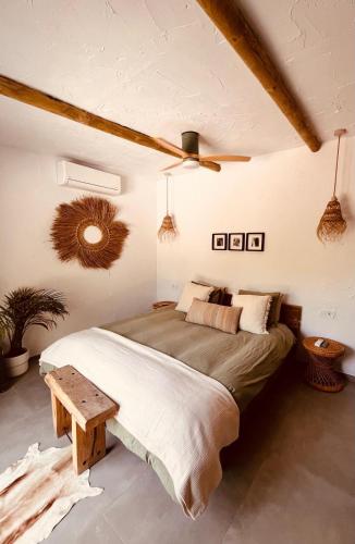 a bedroom with a bed and a ceiling fan at Finca W - Coín - Málaga - Andalucía in Coín