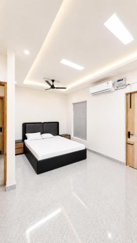 a bedroom with a bed in a room at Mountain top farmhouse in Gurgaon