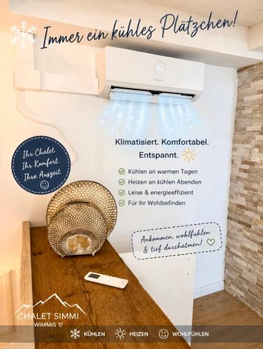 a sign on the wall of a room with a table at Chalet-Simmi in Wimmis