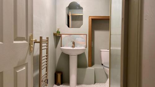 a bathroom with a sink and a toilet at Downton I in Alnwick