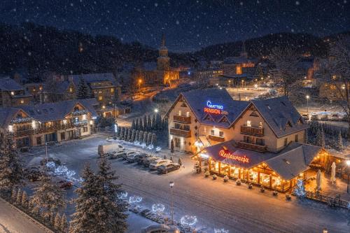 an aerial view of a town at night at MATTEO Pensjonat Apartamenty in Duszniki Zdrój