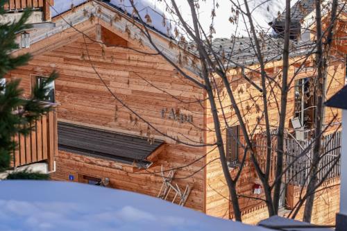 a wooden building with a window on the side of it at Chalet t'Alpa in Bettmeralp