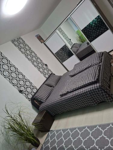 a living room with two pillows on the floor at Zöld otthon in Szeged