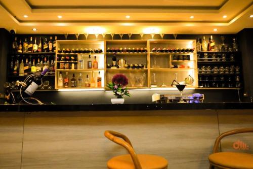 a bar with a counter with bottles of wine at Nile View Hotels in Bahir Dar