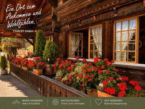 a display of flowers in front of a building at Chalet-Simmi in Wimmis