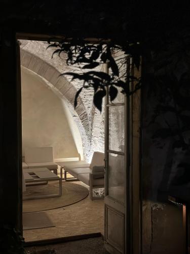 a view of a room with chairs and a table at La Maison du 19 in Cluny