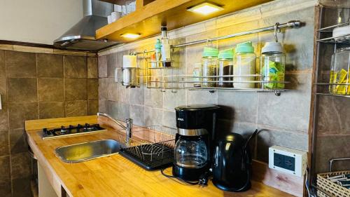 a kitchen with a counter with a coffee maker on it at Ñireco HOUSE in San Carlos de Bariloche